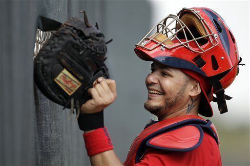 Yadier Molina jokes with teammate during spring training on Feb. 16, 2011